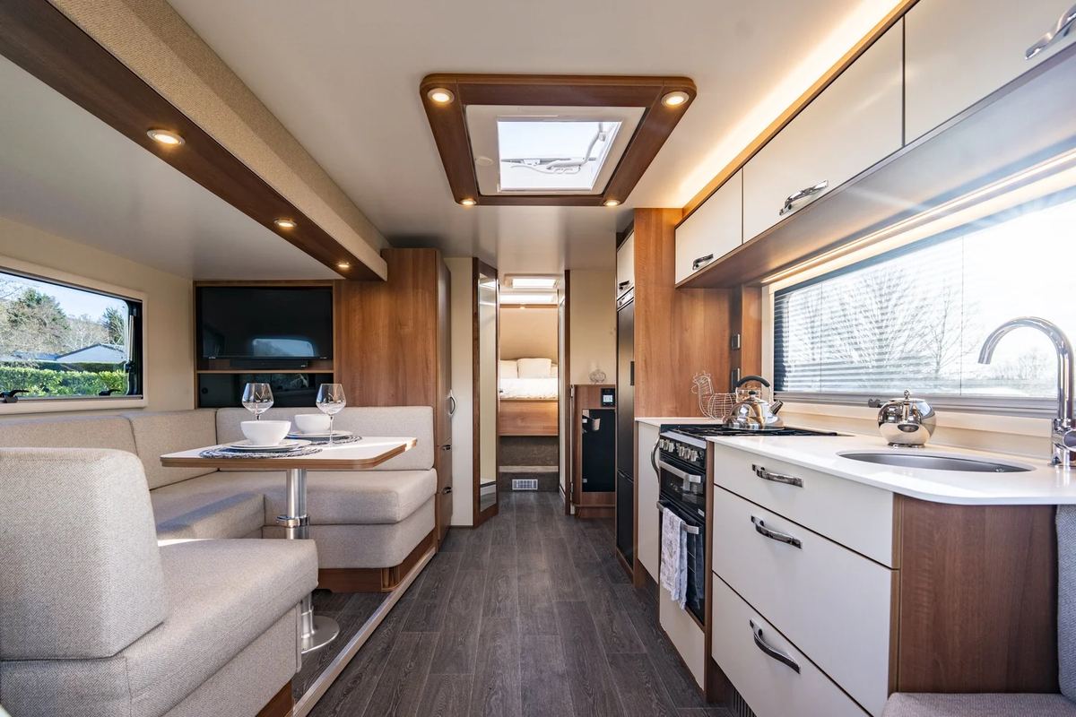 Inside the Dreamseeker: the dinette and galley kitchen, looking through to the island bed at the rear