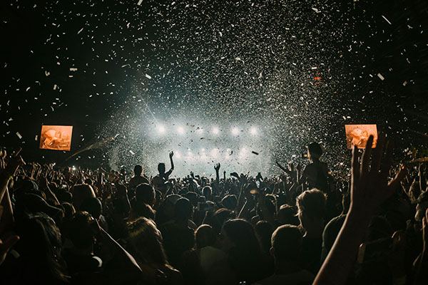 Confetti falling through the lights over the Reading and Leeds crowd as the headliner peaks
