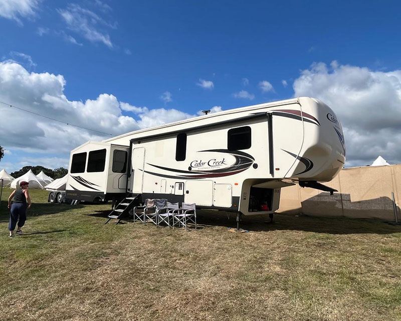 A Stay Go Premium fifth wheel sited and set up, slide-outs open, ready for arrival