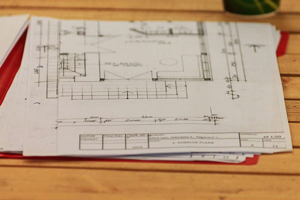 A warm site office set up for drawings, briefings and planning